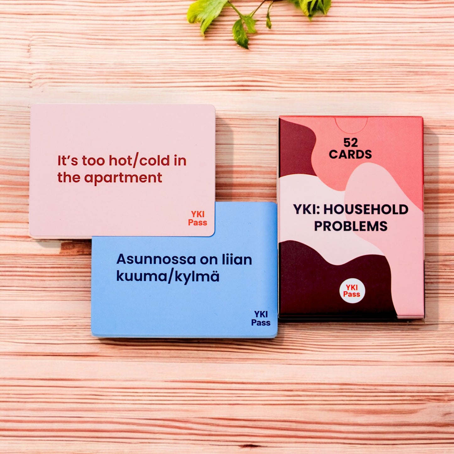 Household problems flashcards image on a wooden table and it says it is too hot in the apartment.