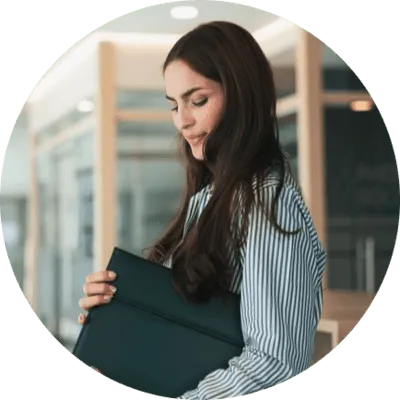 An image of a woman with a document file in her hands.